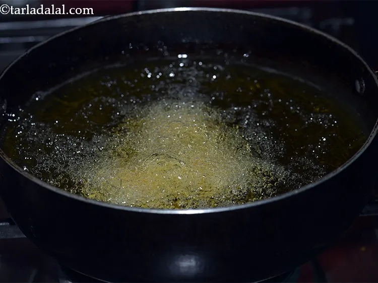 Step 24 – Add a few balls at a time and deep fry on a medium flame till …