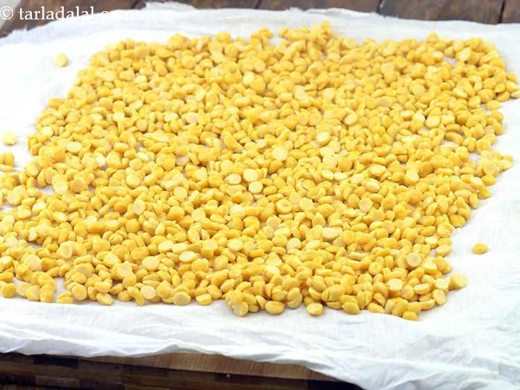 Step 21 – To further ensure that the chana dal is drained well, spread them on a big …
