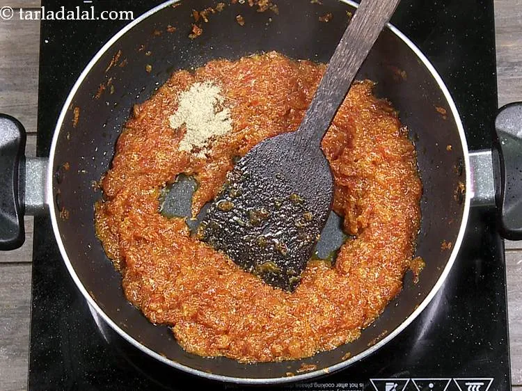 Step 20 – Add cardamom powder to perk up the flavor and make carrot pudding aromatic.