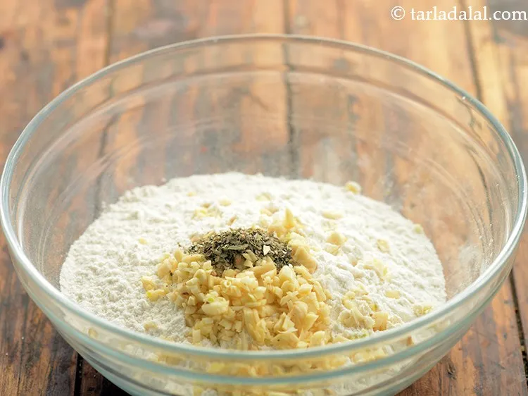 Step 9 – Add oregano to give a nice flavour to garlic bread sticks.