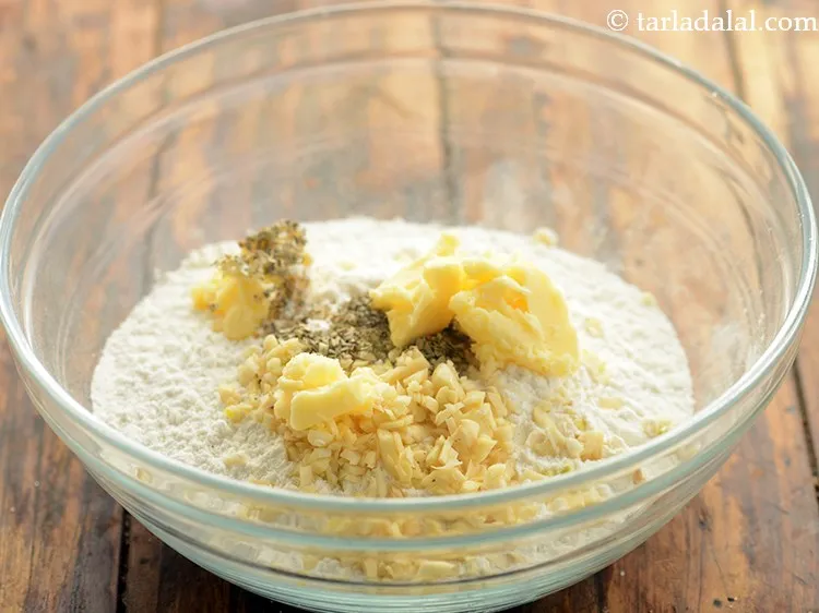 Step 10 – Add butter. It helps in making the dough more tender and bread soft.