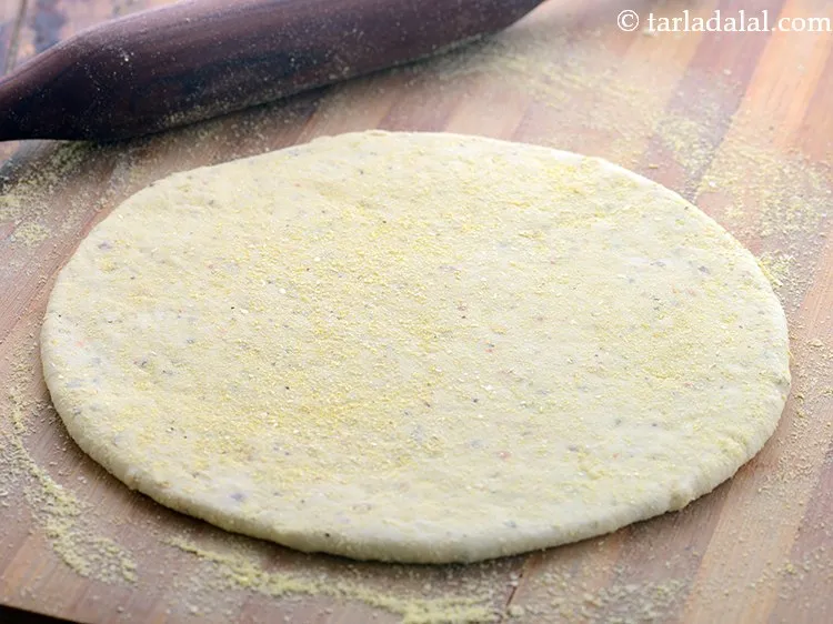 Step 29 – Roll a portion of the dough into a 175 mm. (7&rdquo;) diameter circle using a …