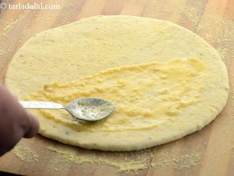 Step 30 – Spread &frac12; of the garlic butter mixture on one side of the circle, leaving the …