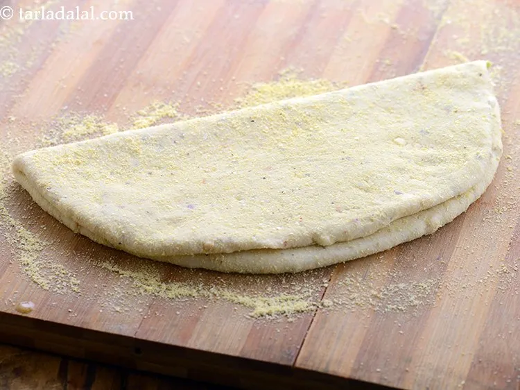 Step 31 – Cover it with the other half of the dough to make a semi-circle.