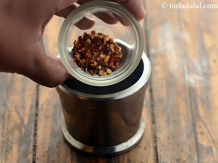 Step 21 – Add 1 tsp dry red chilli flakes (paprika).&nbsp;