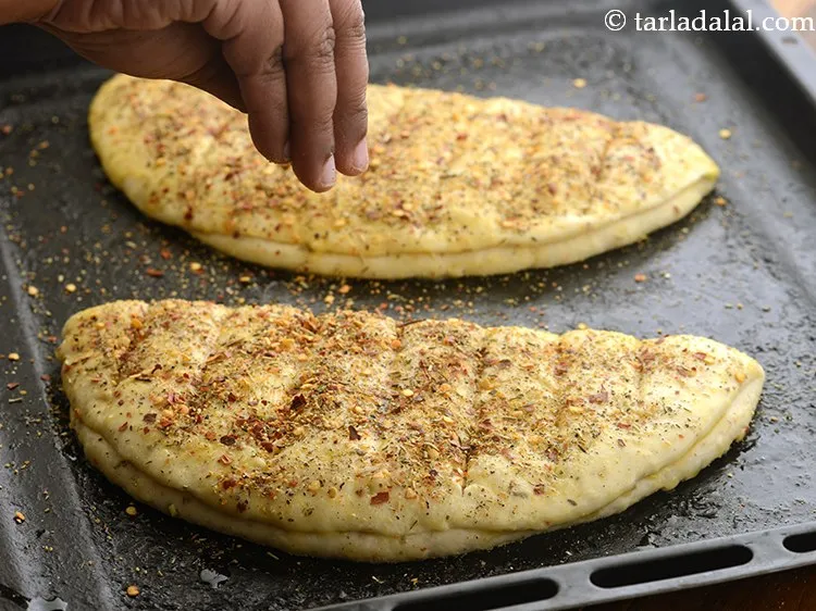 Step 39 – Sprinkle the prepared spice mixture evenly over them. This gives them the perfect all-over garlic …