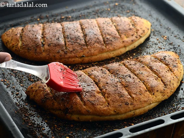 Step 41 – Once baked, brush 2 tsp of melted butter over each&nbsp;<strong>Dominos style garlic bread sticks | …