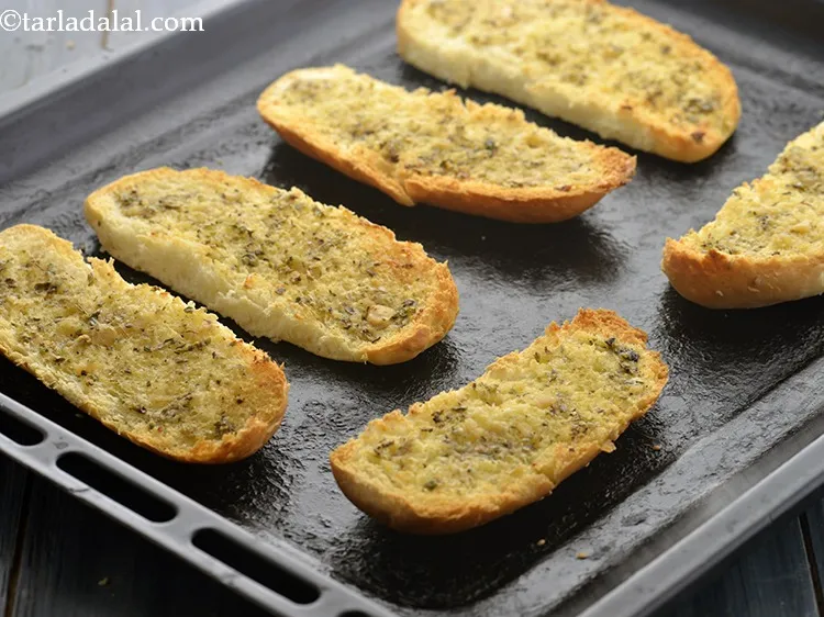 Step 13 – Bake the <strong>garlic bread</strong> in a preheated oven at 200&deg;C (400&deg;F) for 8 to 10 …