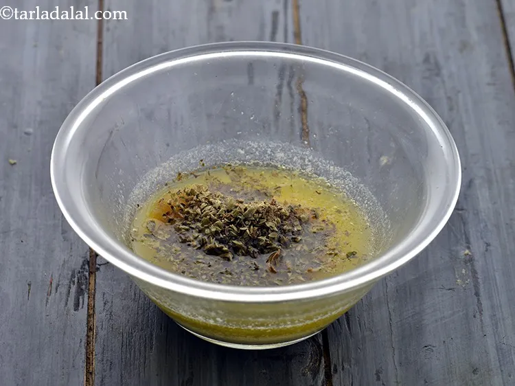 Step 7 – Add the dried mixed herbs. Also, to pop in some colour, add finely chopped parsley.