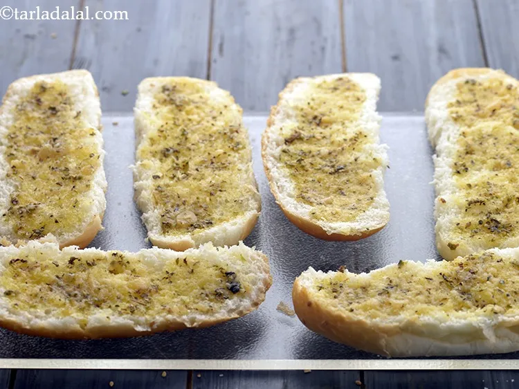 Step 11 – Spread a little of the garlic spread evenly on each halve of the hot dog …