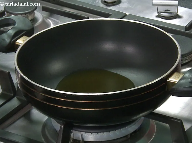 Step 7 – To prepare instant&nbsp;<strong>garlic pickle recipe | lahsun achar | Punjabi lahsun achar |</strong>&nbsp;heat the oil …