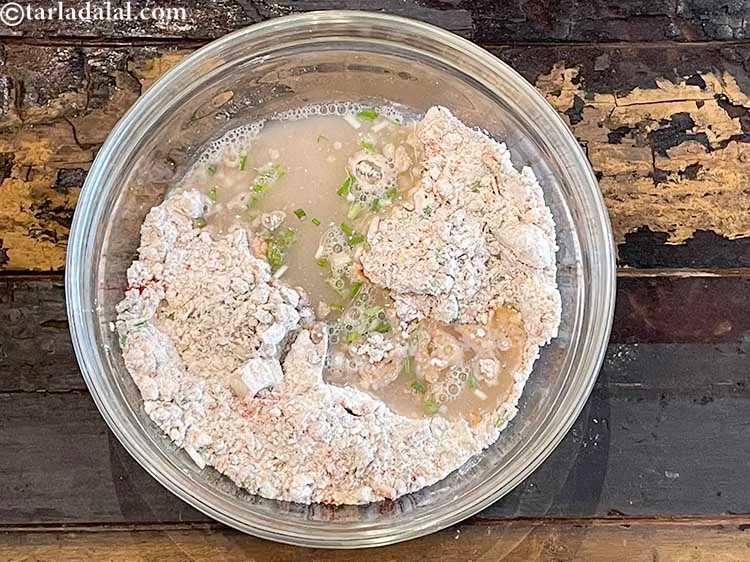 Step 13 – Add enough warm water to make a soft dough.