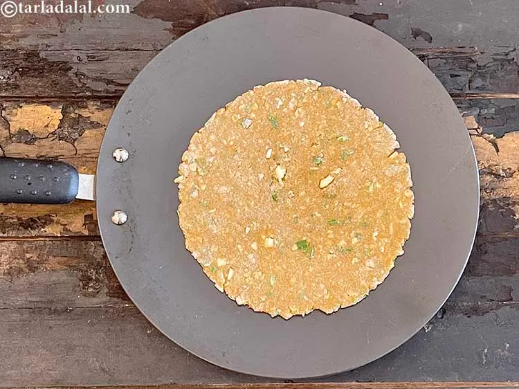 Step 18 – Heat a non-stick tava (griddle) and cook each roti for 30 seconds without adding any …