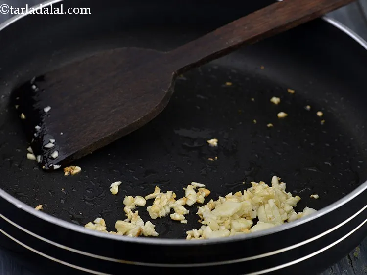 Step 23 – Add garlic to it. You need to peel the garlic cloves and finely chop the …