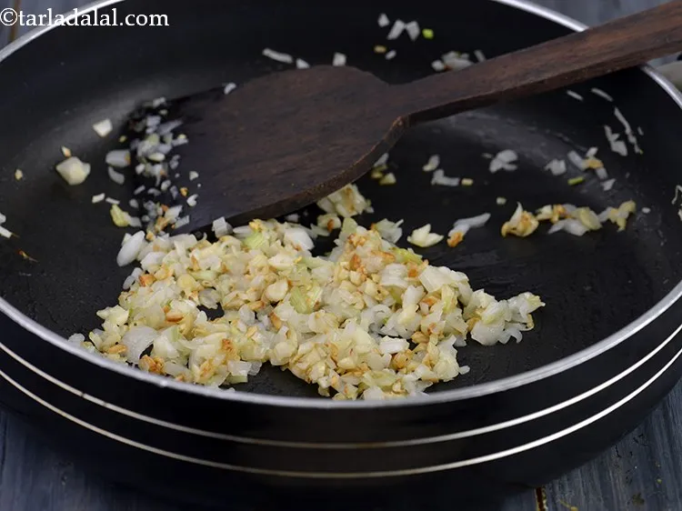 Step 25 – Saut&eacute; the spring onions whites and garlic on a medium flame for 1 to 2 …