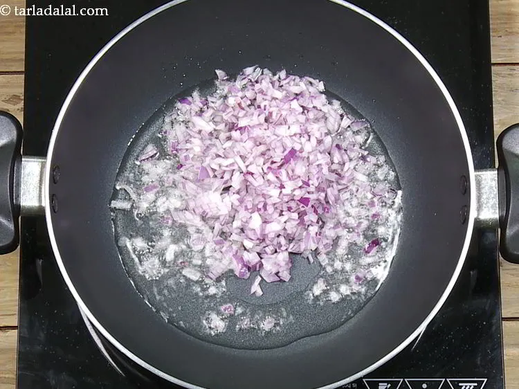 Step 15 – Once the oil is hot, add the onions.