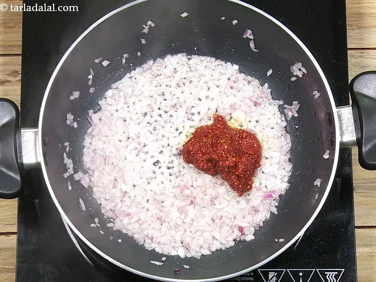Step 17 – Add the red chilli-garlic paste and saut&eacute; on a medium flame for 1 minute.