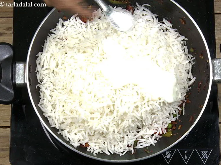 Step 26 – Add curd and salt. Curd helps in reducing the heat from chillies and balance the …