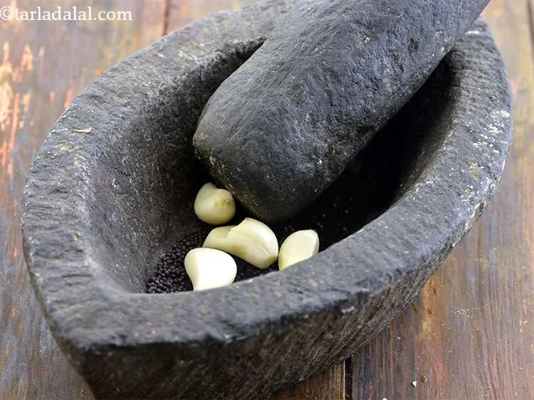 Step 3 – Add the garlic cloves.