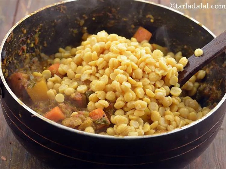 Step 27 – Add the boiled chana dal.