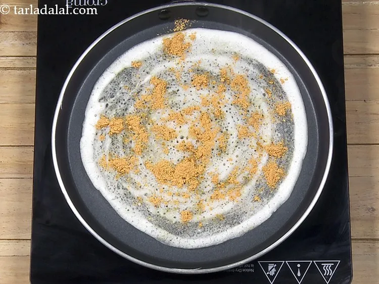 Step 30 – At this stage when it is half cooked, sprinkle 1 tsp of malgapodi powder evenly …