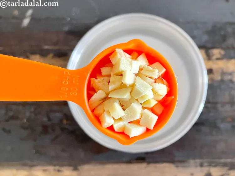 Step 13 – Add&nbsp;<meta charset="UTF-8" />2 tbsp&nbsp;roughly&nbsp;<a href="glossary-chopped-ginger-786i">chopped ginger (adrak)</a>.