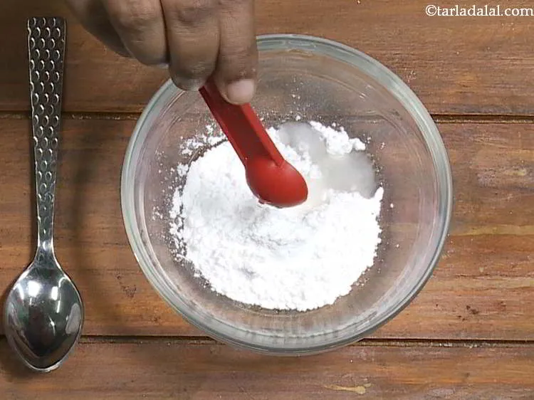 Step 16 – Here we are going to make a simple sugar icing. For this, combine the sugar …