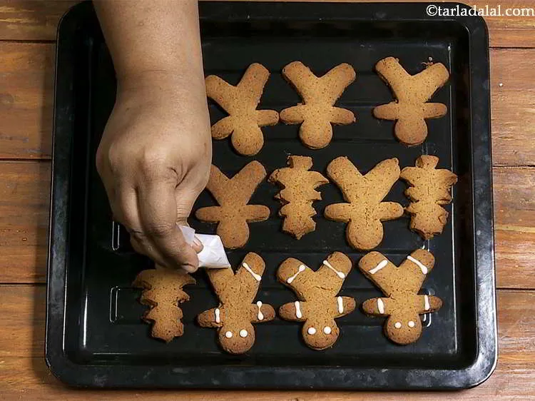 Step 20 – Decorate the cookies using the icing as desired. For example for the gingerbread man, you …
