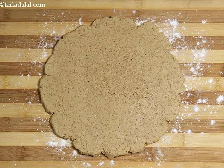 Step 10 – Roll the dough out gently into a 200 mm. (8") diameter circle. The dough should …