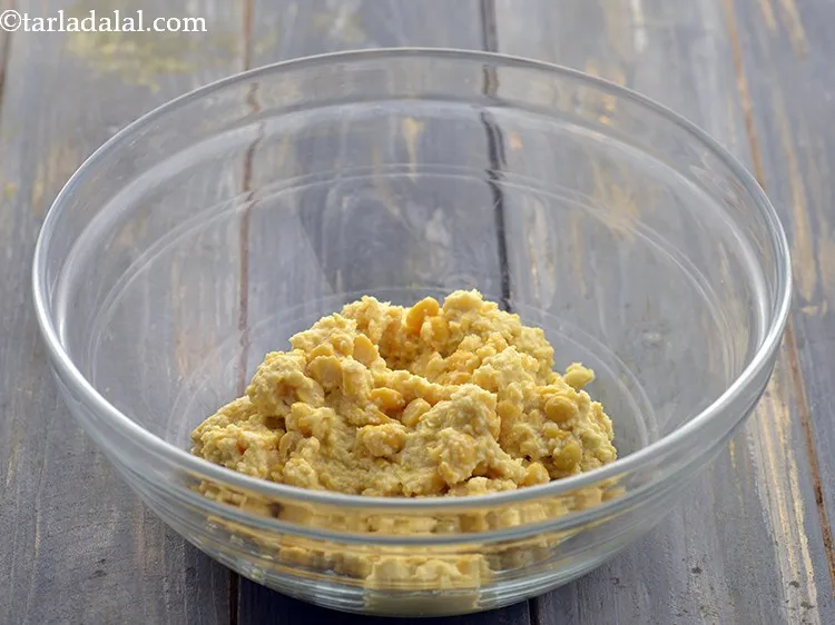 Step 16 – Transfer the coarsely crushed dal to a bowl. If you crush it smooth, the batter …