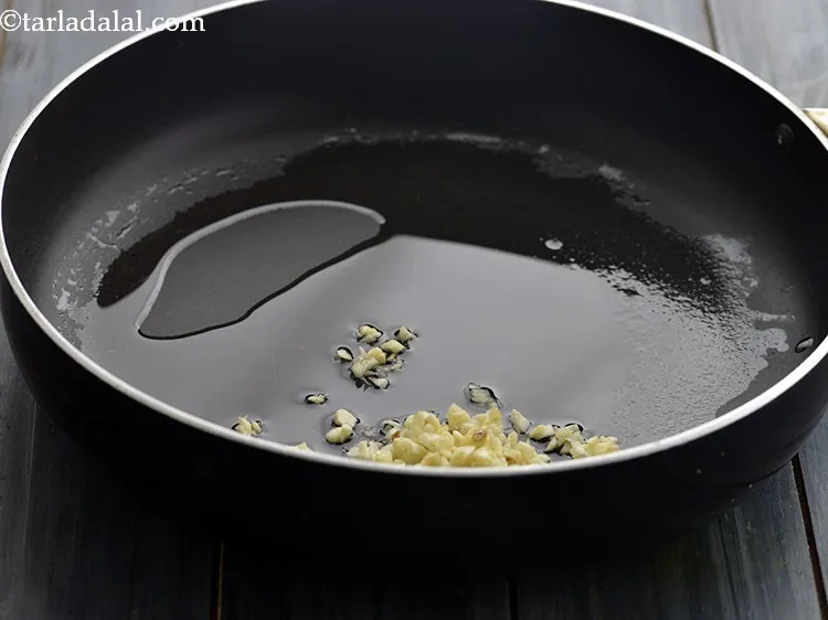 Step 28 – Add the garlic.