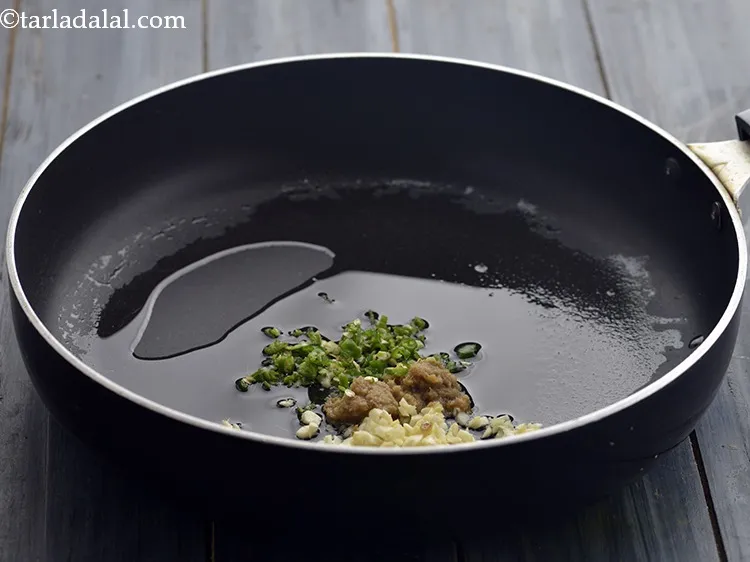 Step 30 – Add the green chillies and saut&eacute; on a medium flame for a few seconds.