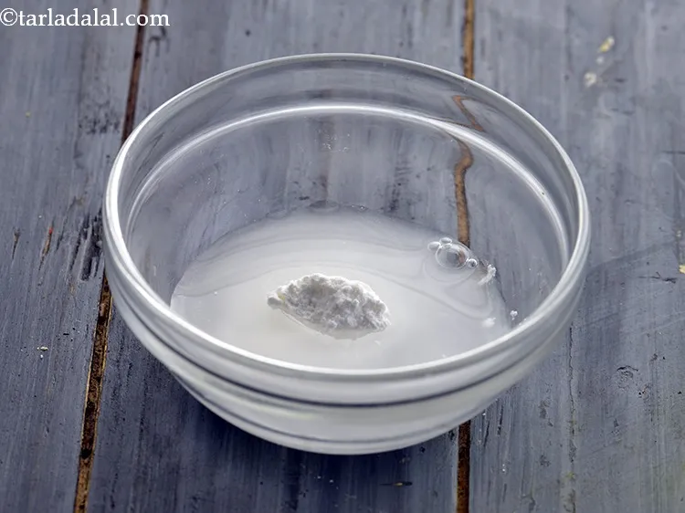 Step 25 – Combine the cornflour with 2 tbsp water in a bowl.