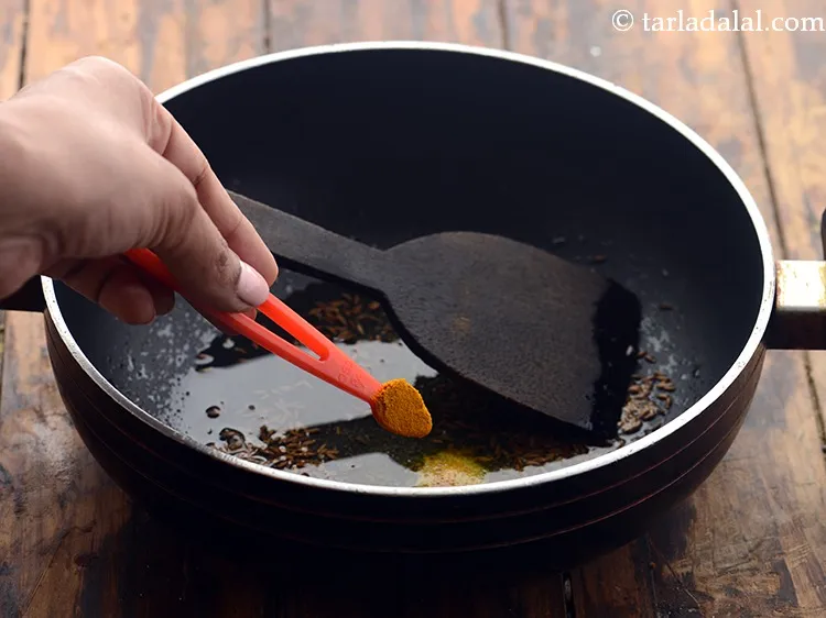 Step 6 – When the seeds crackle, add the turmeric powder. Adding haldi in tempering helps to provide …