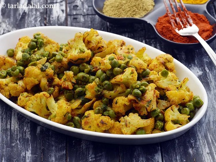 Step 15 – Serve <strong>cauliflower vatana nu shaak</strong> hot with roti or chapati.&nbsp;<a href="https://www.tarladalal.com/Garlic-Cauliflower-Spicy-Gobhi-Recipe-41918r" target="_blank">Garlic Cauliflower</a>, <a href="https://www.tarladalal.com/Khatta-Gobhi-22191r" …