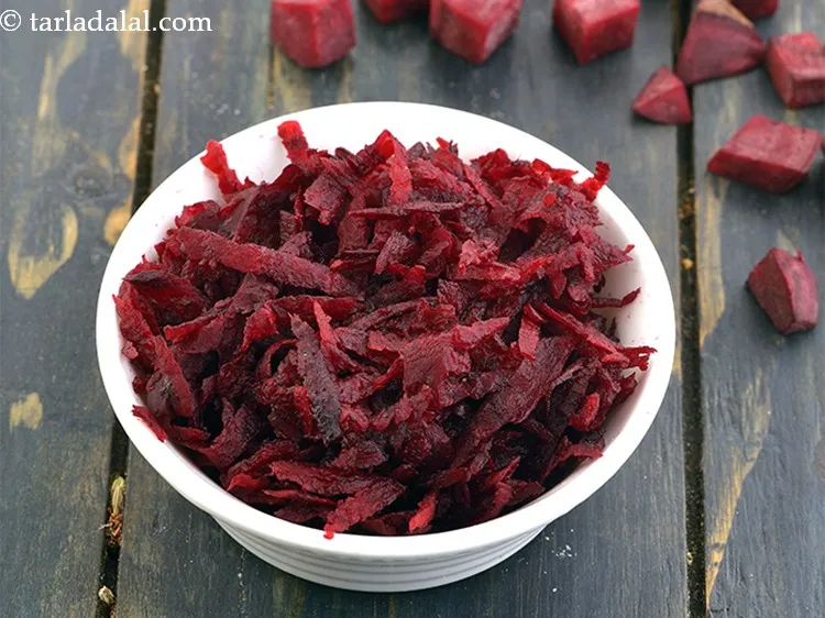 Step 28 – Add 1 cup&nbsp;<a href="https://www.tarladalal.com/glossary-grated-beetroot-940i">grated beetroot</a>.