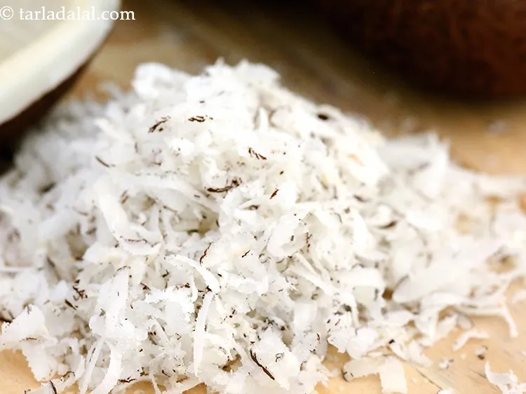 Step 10 – Add 1/4 cup&nbsp;<a href="https://www.tarladalal.com/glossary-grated-dry-coconut-2272i">dry grated coconut</a>.