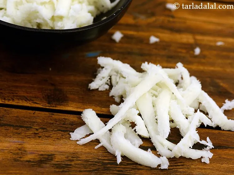 Step 17 – Sprinkle 1/4 cup of <a href="https://www.tarladalal.com/glossary-grated-mozzarella-cheese-1022i">grated mozzarella cheese</a>.