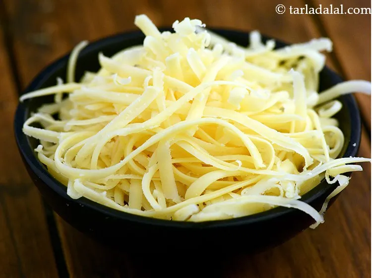 Step 13 – Switch of the flame, add 1/4 cup&nbsp;<a href="https://www.tarladalal.com/glossary-grated-processed-cheese-868i">grated processed cheese</a> and mix well.