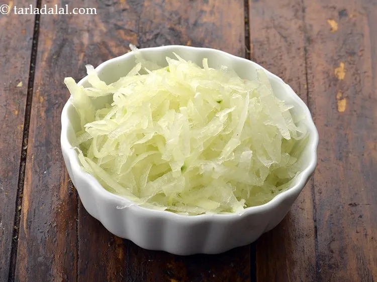 Step 16 – Add 1 cup&nbsp;thickly&nbsp;<a href="https://www.tarladalal.com/glossary-grated-raw-papaya-2063i">grated raw papaya</a>.