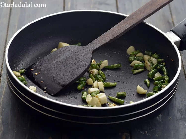 Step 8 – Add the garlic. Saut? on a medium flame for 1 minute.