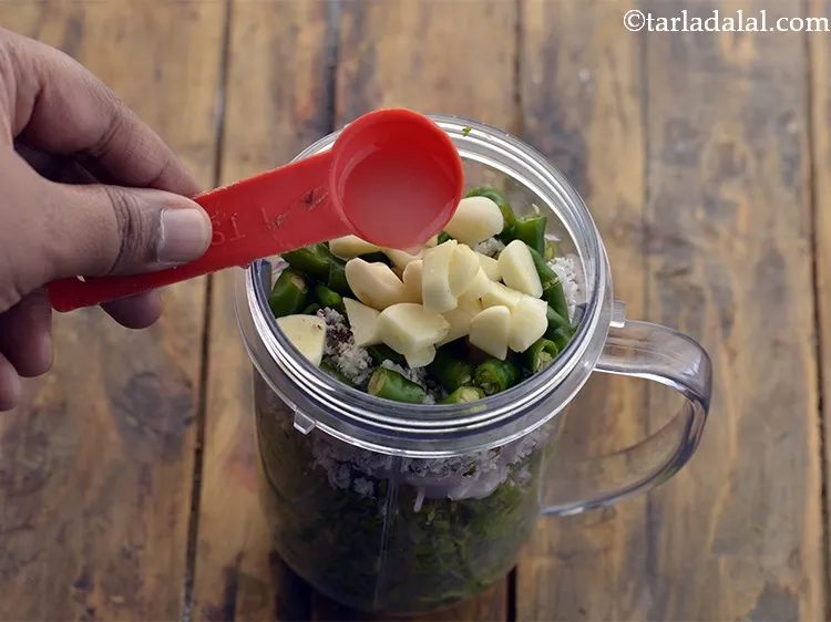 Step 10 – Add the lemon juice. This helps in maintaining the bright green colour of the paste.