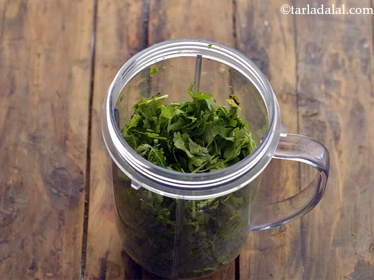 Step 4 – Transfer the roughly chopped coriander to a mixer jar.