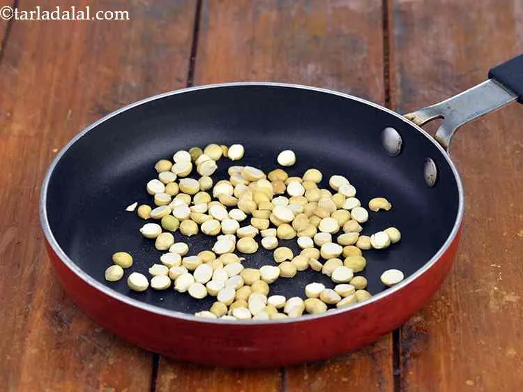 Step 8 – In a broad non-stick pan, take 1&nbsp;tbsp. of chana dal (daria).&nbsp;