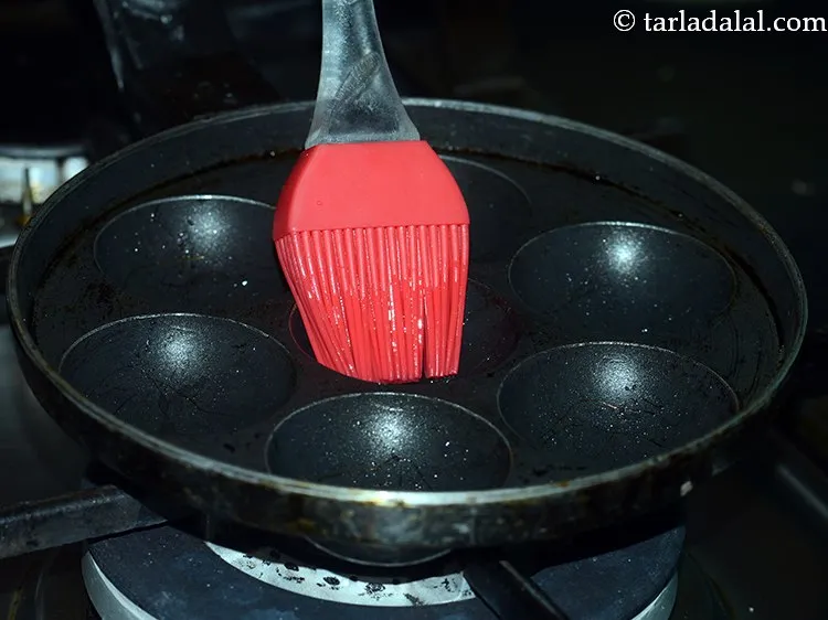 Step 17 – To cook <strong>green moong dal appe</strong>, heat an appe mould on a medium flame and …