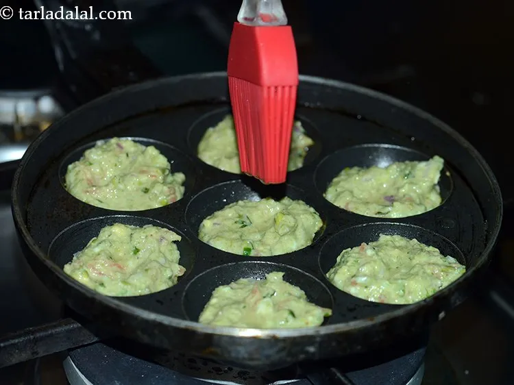 Step 19 – Cook, using &frac14; tsp of oil, till the lower surface becomes golden brown.