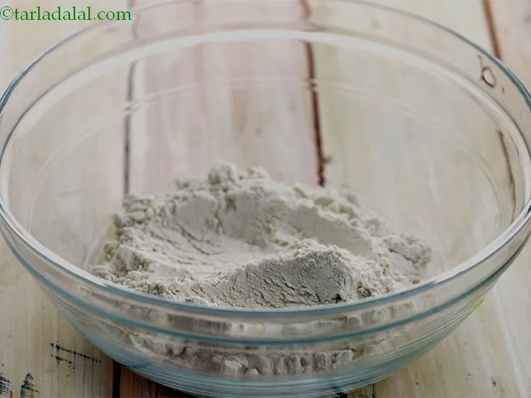 Step 11 – Take a deep bowl and put &frac12; cup of wheat flour into it.