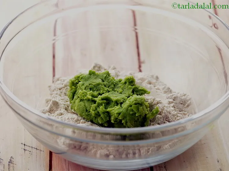 Step 12 – Then add the boiled green pea paste to it.