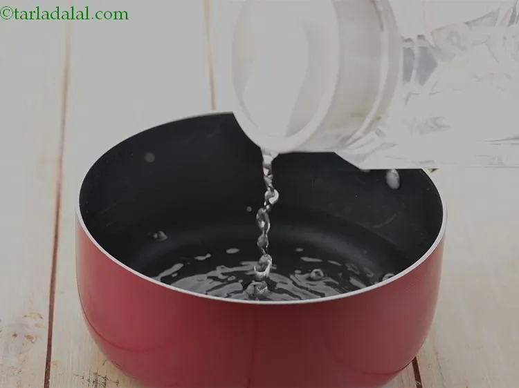 Step 3 – Add enough water into it to boil the green peas.