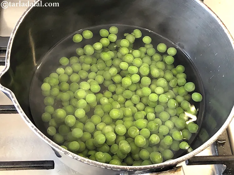 Step 11 – Put the green peas in a pan with enough water.